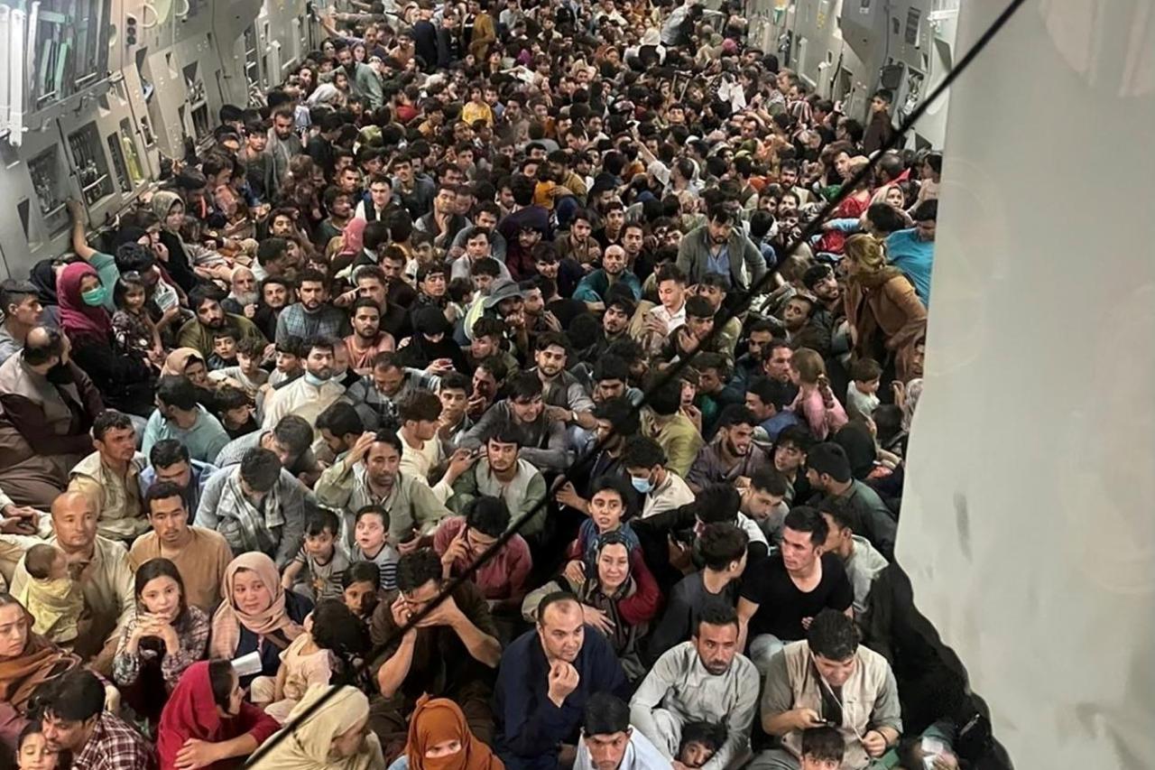 Afghan evacuees crowd the interior of a U.S. Air Force C-17 Globemaster III transport aircraft flying from Kabul