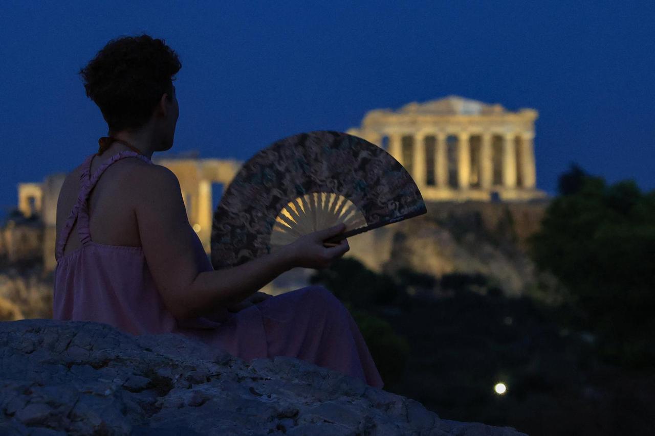 Tourists enjoy Acropolis view in Athens