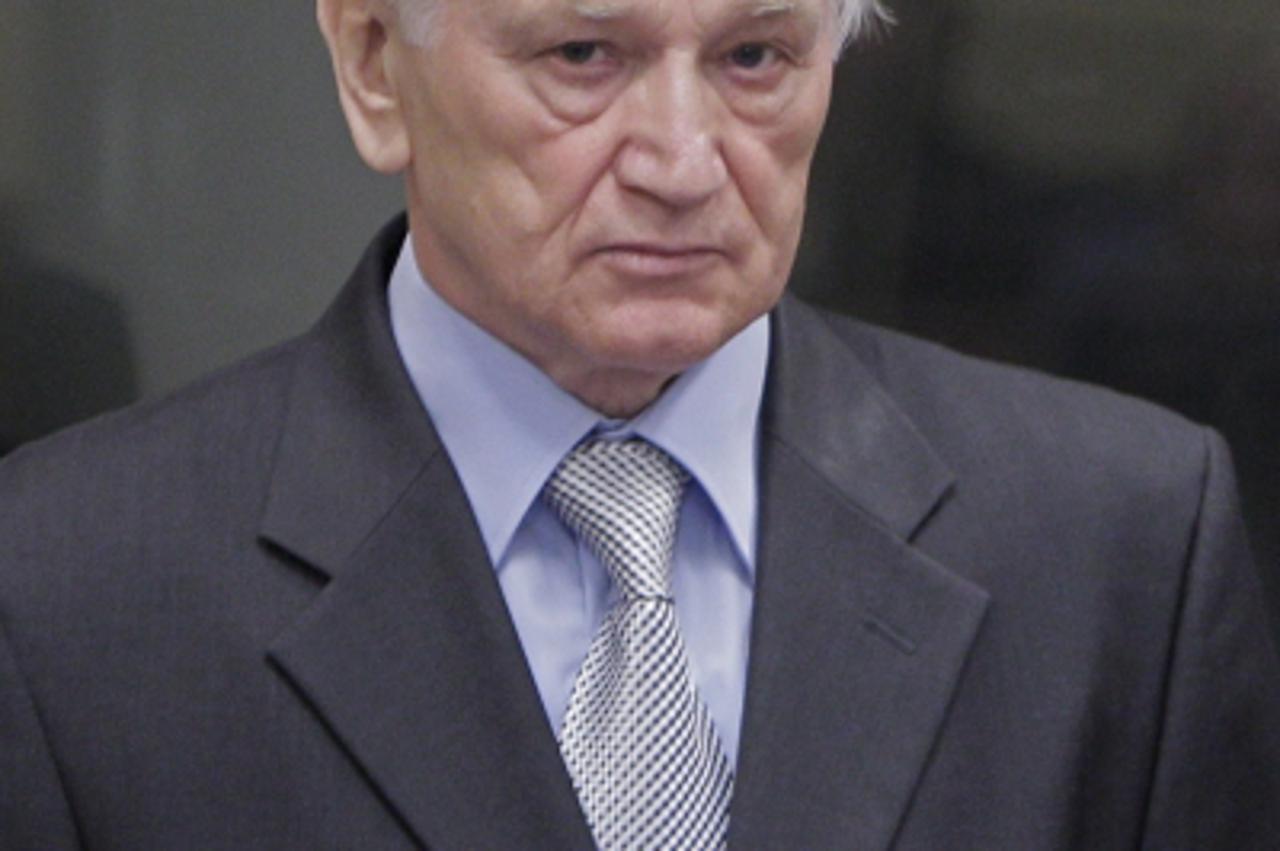 'The former chief of staff of the Yugoslav Army, Momcilo Perisic, enters on September 6, 2011 the courtroom of the International Criminal Tribunal for the former Yugoslavia (ICTY) in the Hague to hear