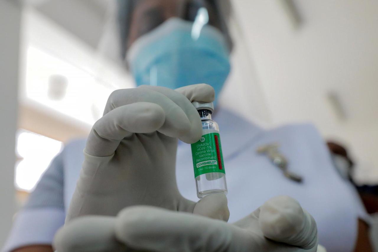 FILE PHOTO: A Health official shows a bottle with a dose of the AstraZeneca's COVID-19 vaccine manufactured by the Serum Institute of India, at Infectious Diseases Hospital in Colombo