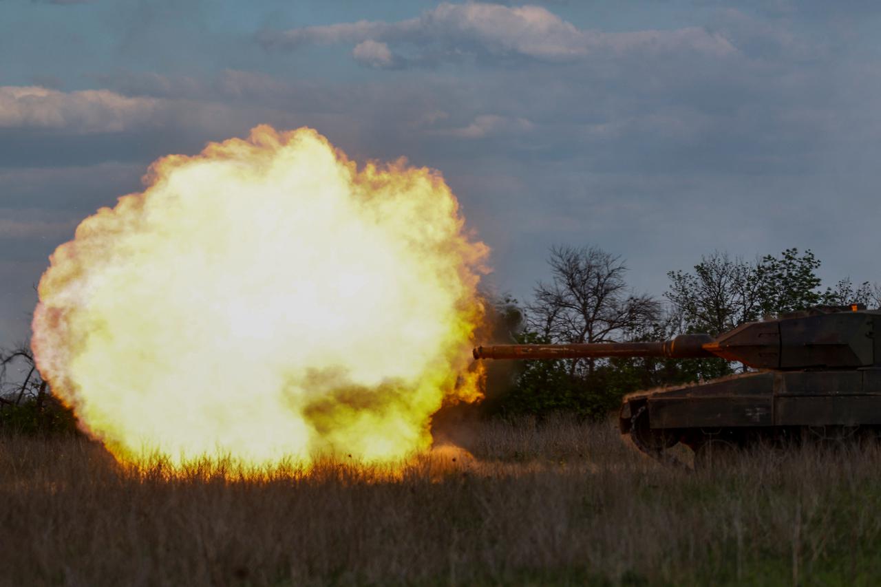 Ukrainian servicemen fire a Leopadr 2A6 tank during a military exercise in Donetsk region