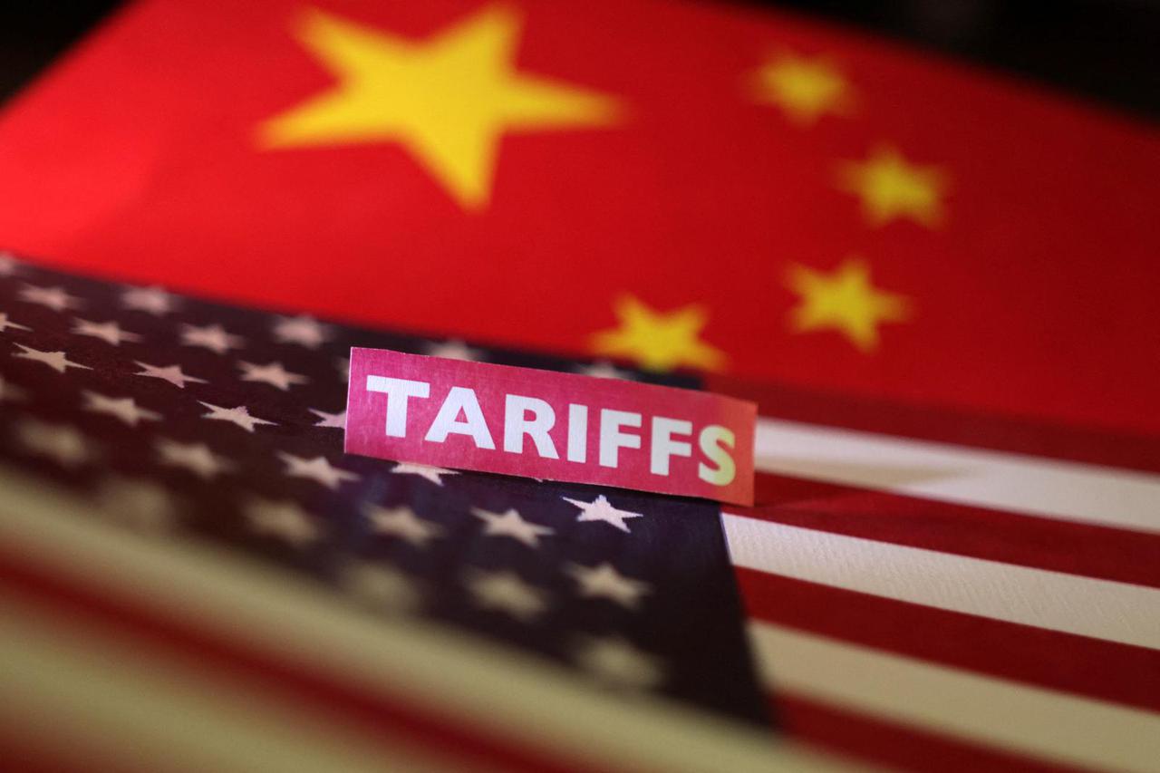 Illustration shows U.S. and Chinese flags and "tariffs" label
