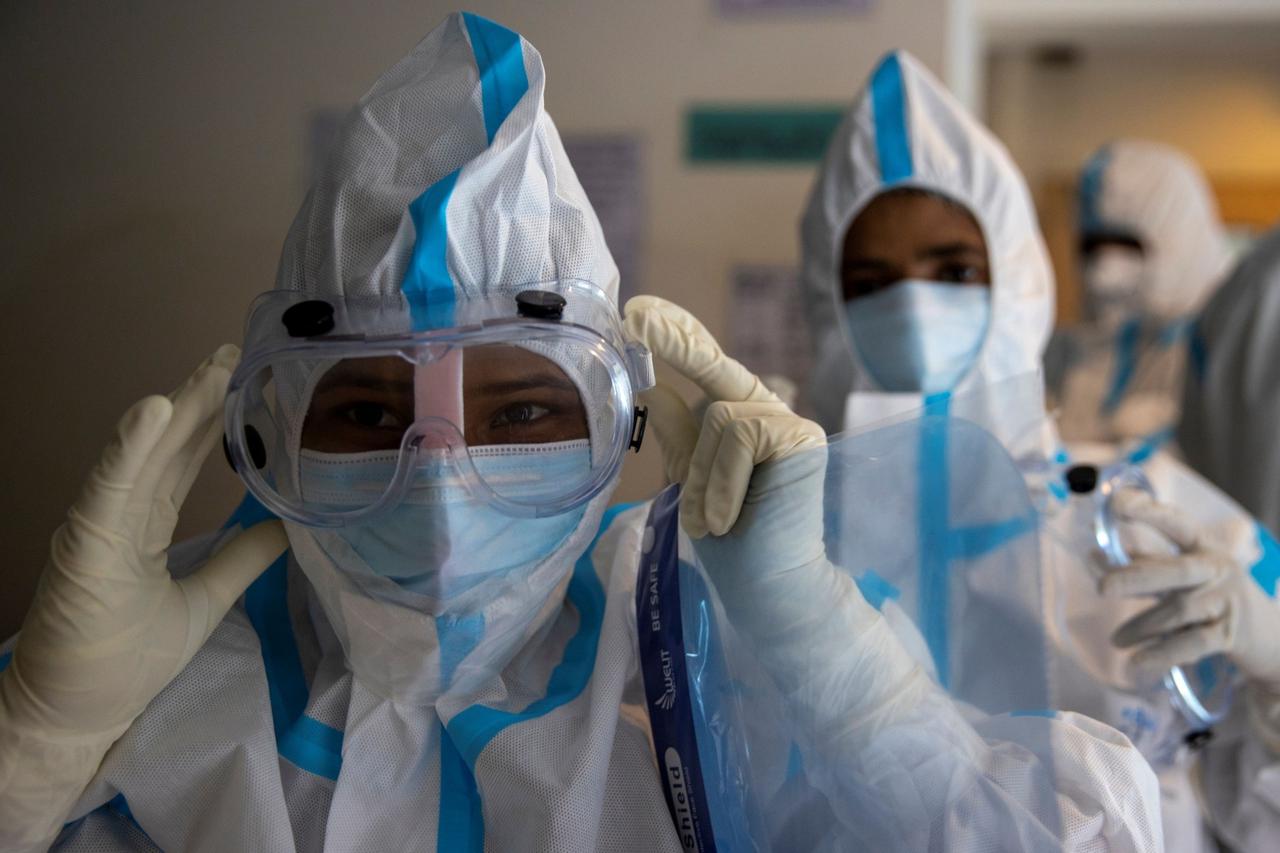 Medical workers treat patients infected with the coronavirus disease (COVID-19) at a hospital in New Delhi