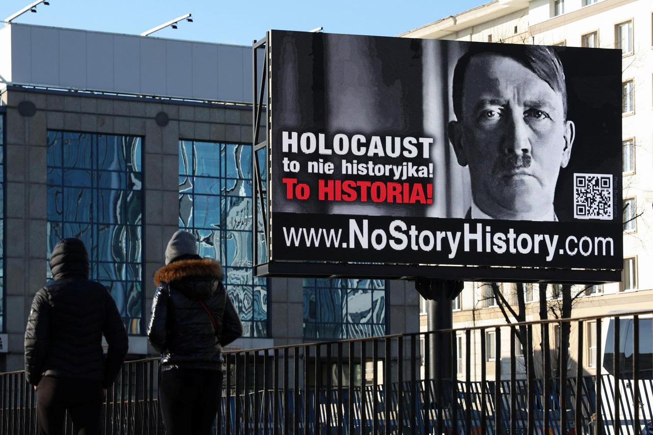 A campaign poster depicting Adolf Hitler is displayed in central Warsaw