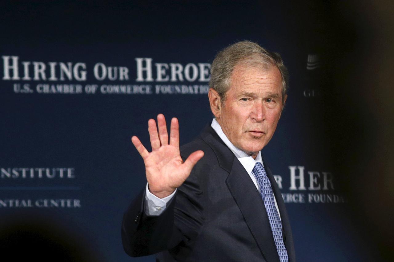 Former U.S.  President George W. Bush waves as he departs the stage after speaking at the U.S. Chamber of Commerce Mission Transition summit, to discuss creating employment opportunities for post-9/11 veterans and military families in Washington June 24, 