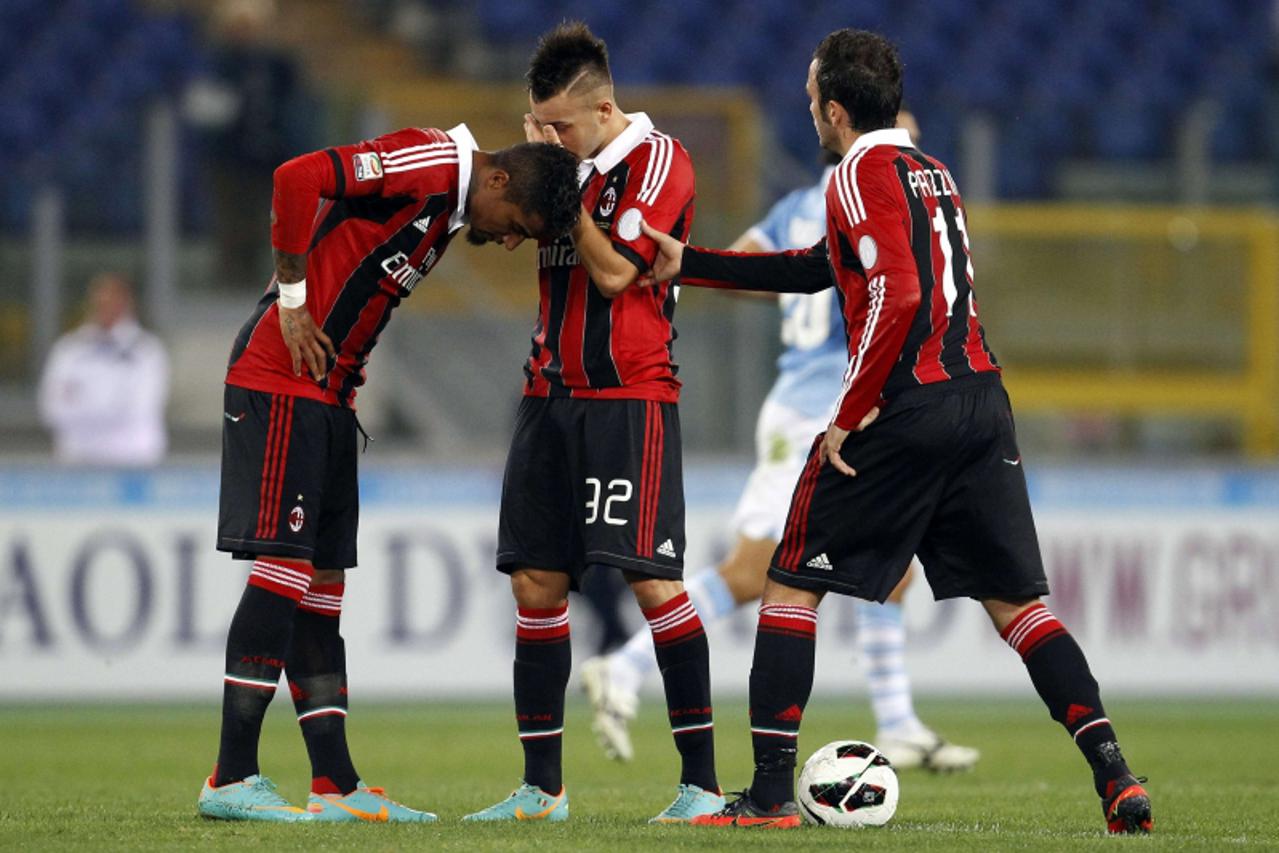 '(L-R) AC Milan\'s Kevin Prince Boateng, Stephan El Shaarawy and Gianpaolo Pazzini react after Lazio\'s Antonio Candreva (not seen) scored during their Italian Serie A soccer match at the Olympic stad