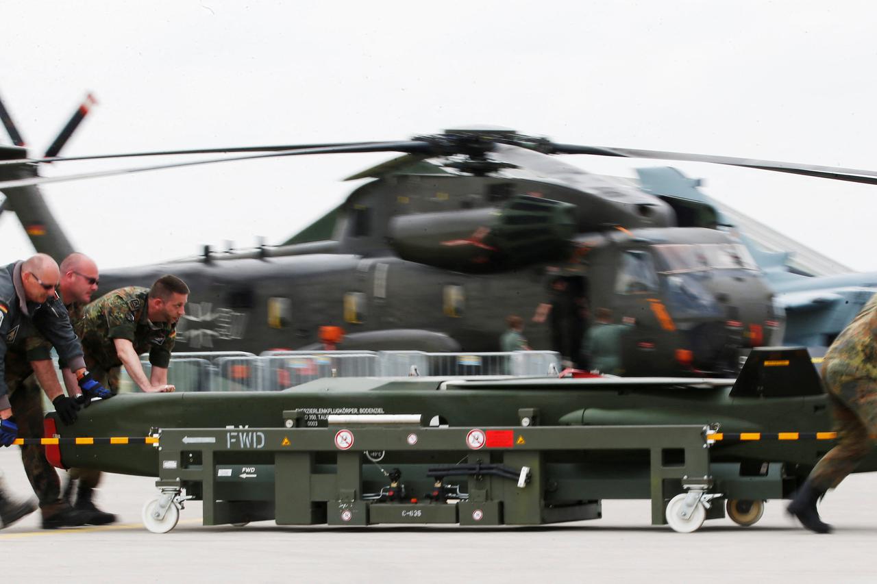 FILE PHOTO: German soldiers move a dummy Taurus bomb during preparations for the upcoming ILA Berlin Air Show in Schoenefeld