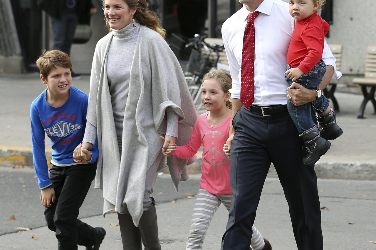 Liberal leader Justin Trudeau arrives at the polling station with his wife Sophie, sons Hadrien (R), Xavier (L) and daughter Ella-Grace (C) in Montreal, Quebec, October 19, 2015. Canadians go to the polls in a federal election on Monday. REUTERS/Chris Wat