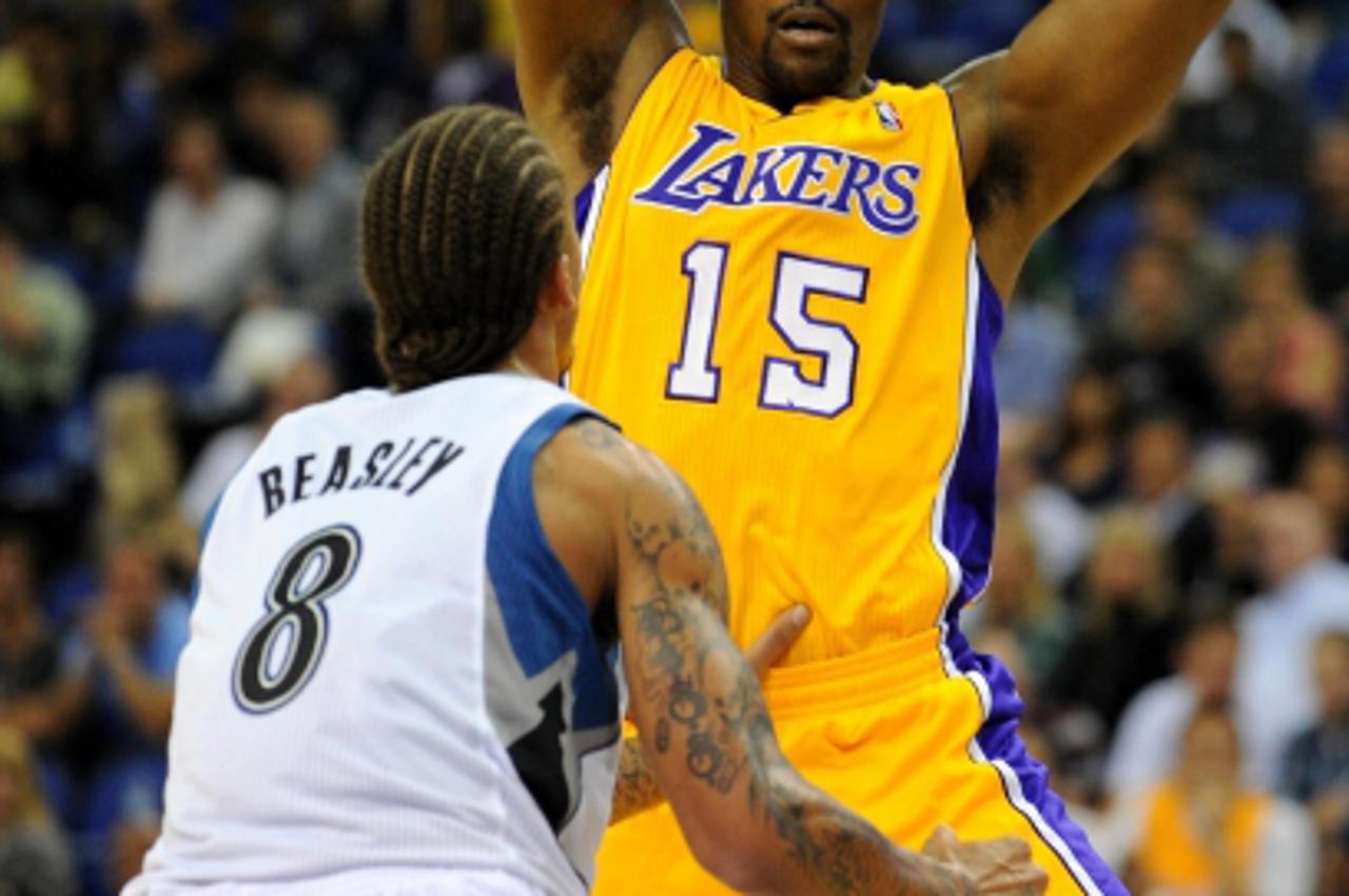 'LA Lakers\' Ron Artest takes on Minnesota Timberwolves\' Michael Beasley (left) during the NBA Europe Live match at the O2 Arena, London. Photo: Press Association/Pixsell'