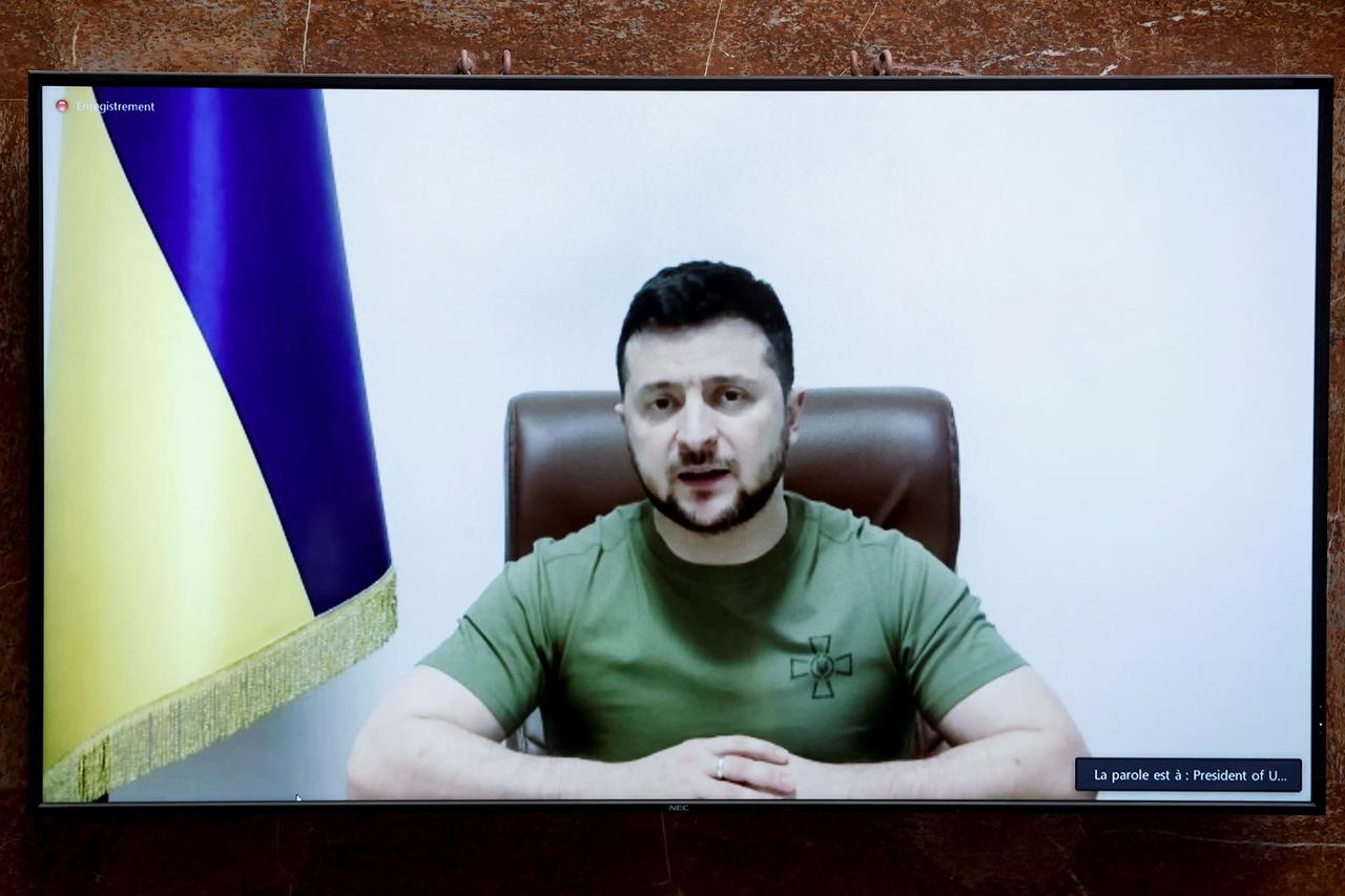 Ukraine's President Zelenskiy addresses French lawmakers via video link, in Paris