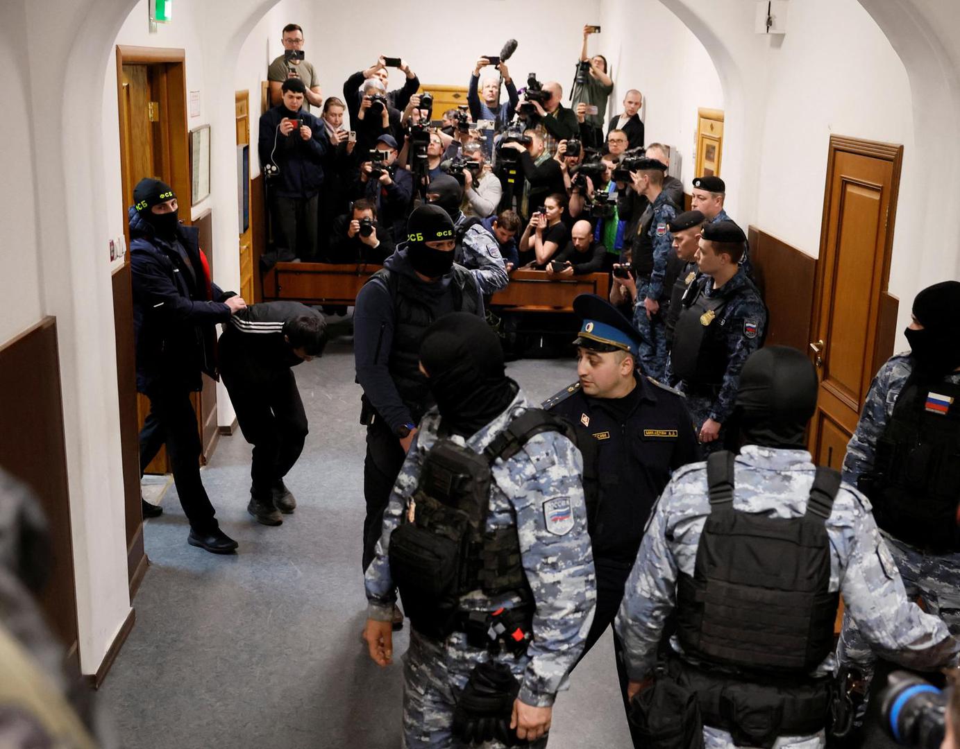 Shamsidin Fariduni, a suspect in the shooting attack at the Crocus City Hall concert venue, is escorted before a court hearing at the Basmanny district court in Moscow, Russia March 24, 2024. REUTERS/Shamil Zhumatov Photo: SHAMIL ZHUMATOV/REUTERS