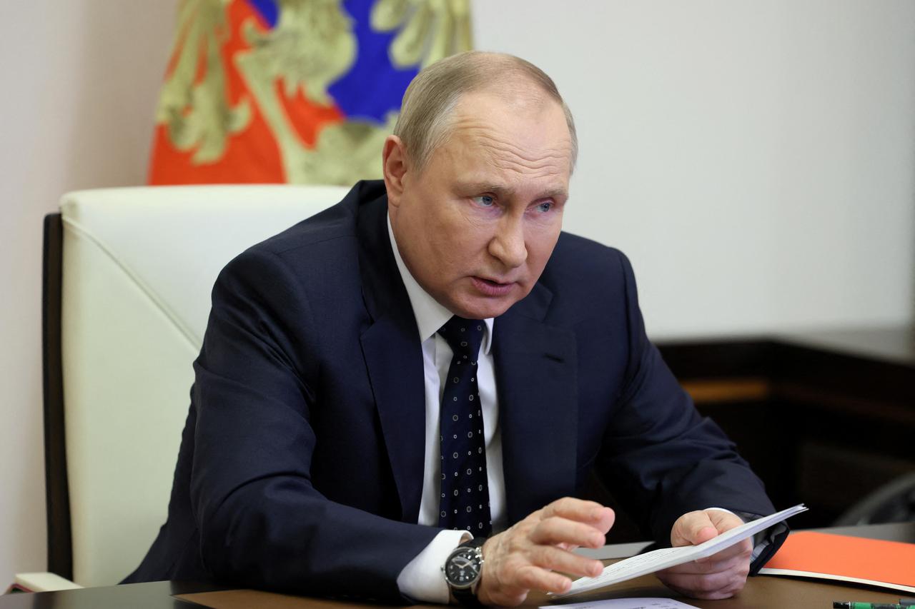 Russian President Putin chairs a meeting with members of the Security Council outside Moscow