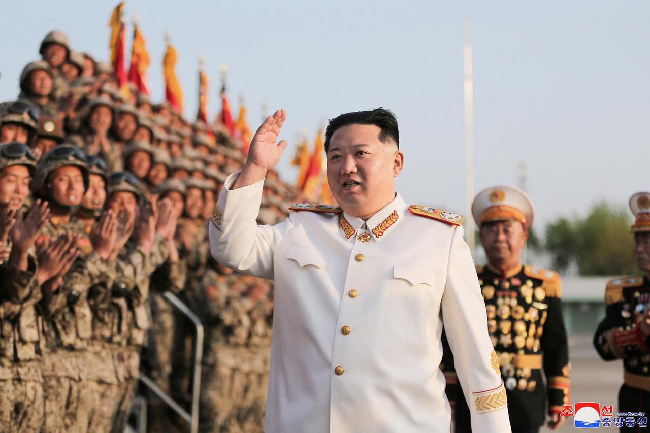North Korean leader Kim Jong Un meets troops who have taken part in the military parade to mark the 90th anniversary of the founding of the Korean People's Revolutionary Army
