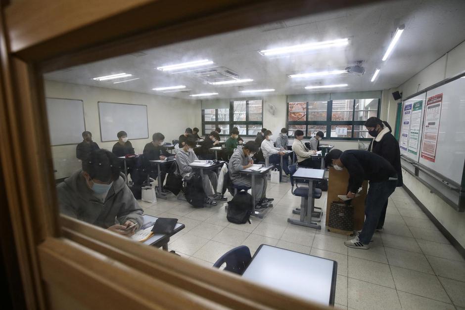 South Korean students take their College Scholastic Ability Test at a school in Seul