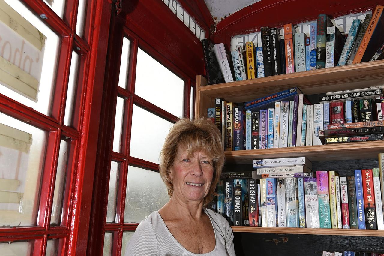 Wall village telephone box libraryWendy Hanlon looks at books in a red phone box which has been converted into a tiny free-to-use library in the village of Wall in Staffordshire.Joe Giddens Photo: Press Association/PIXSELL