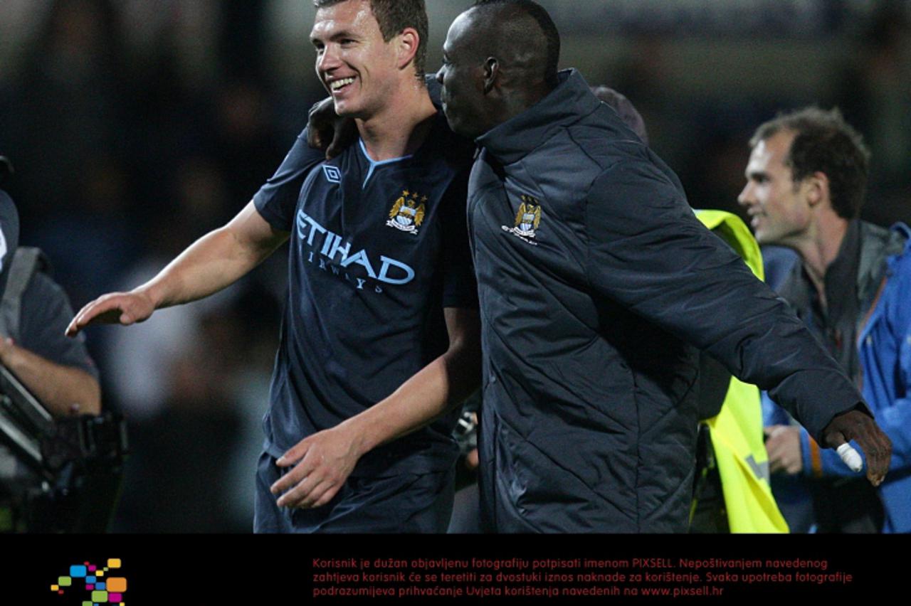 'Manchester City\'s Edin Dzeko celebrates victory with team-mate Mario Balotelli (right) after the final whistle Photo: Press Association/Pixsell'