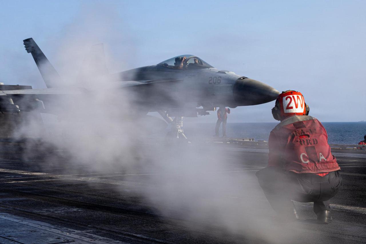 An F/A-18E Super Hornet launches from the flight deck of the U.S. Navy Nimitz-class aircraft carrier USS Abraham Lincoln