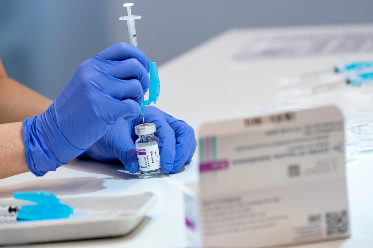 A syringe is filled with the AstraZeneca COVID-19 vaccine at the Skane University Hospital vaccination centre in Malmo