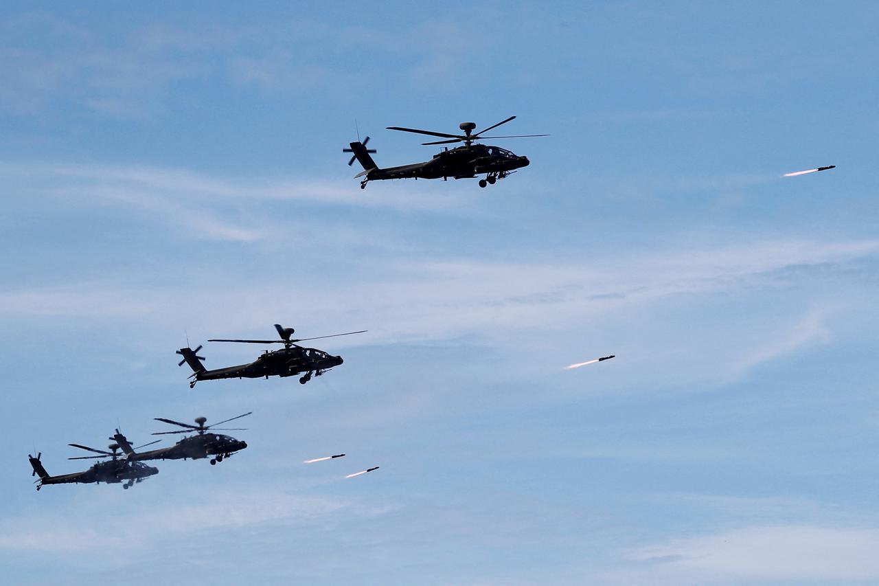FILE PHOTO: AH-1W attack helicopters launch Hellfire missiles during the live fire Han Kuang military exercise, which simulates China's People's Liberation Army (PLA) invading the island, in Pingtung