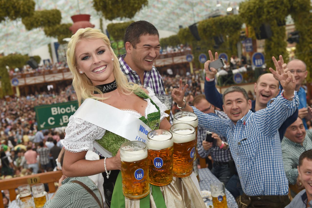 Wiesn Playmate Denise Cotte in the Hofbraeu Tent during the opening of Oktoberfest in Munich,Â Germany, 20Â September 2014. A one-litre stein of Bavarian ale will cost up to 10.10 euro (13.70 US dollar) in the enormous marquees where the world's revellers