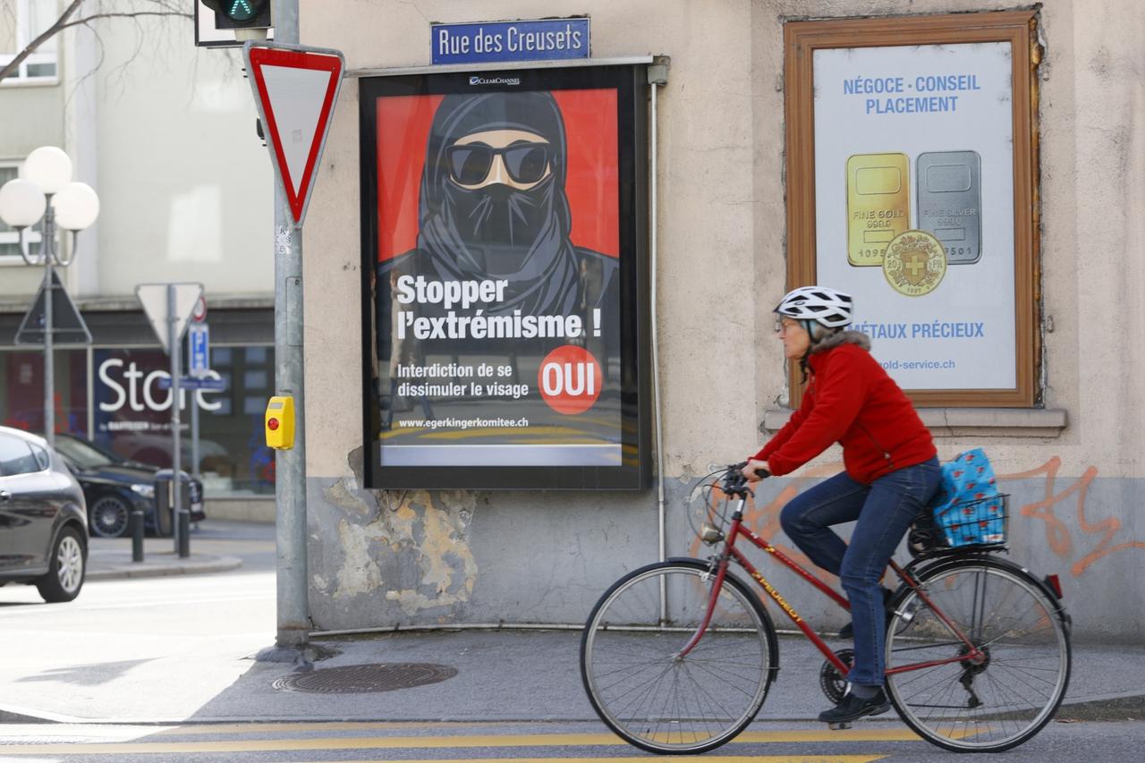 Poster reads "Stop Extremism!" ahead of a Swiss vote on banning face veils in a referendum in Sion