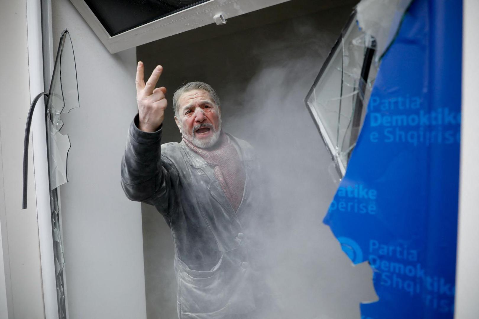 A man gestures as protesters demonstrate outside the headquarters of the Democratic Party in Tirana, Albania, January 8, 2022. REUTERS/Florion Goga Photo: Florion Goga/REUTERS