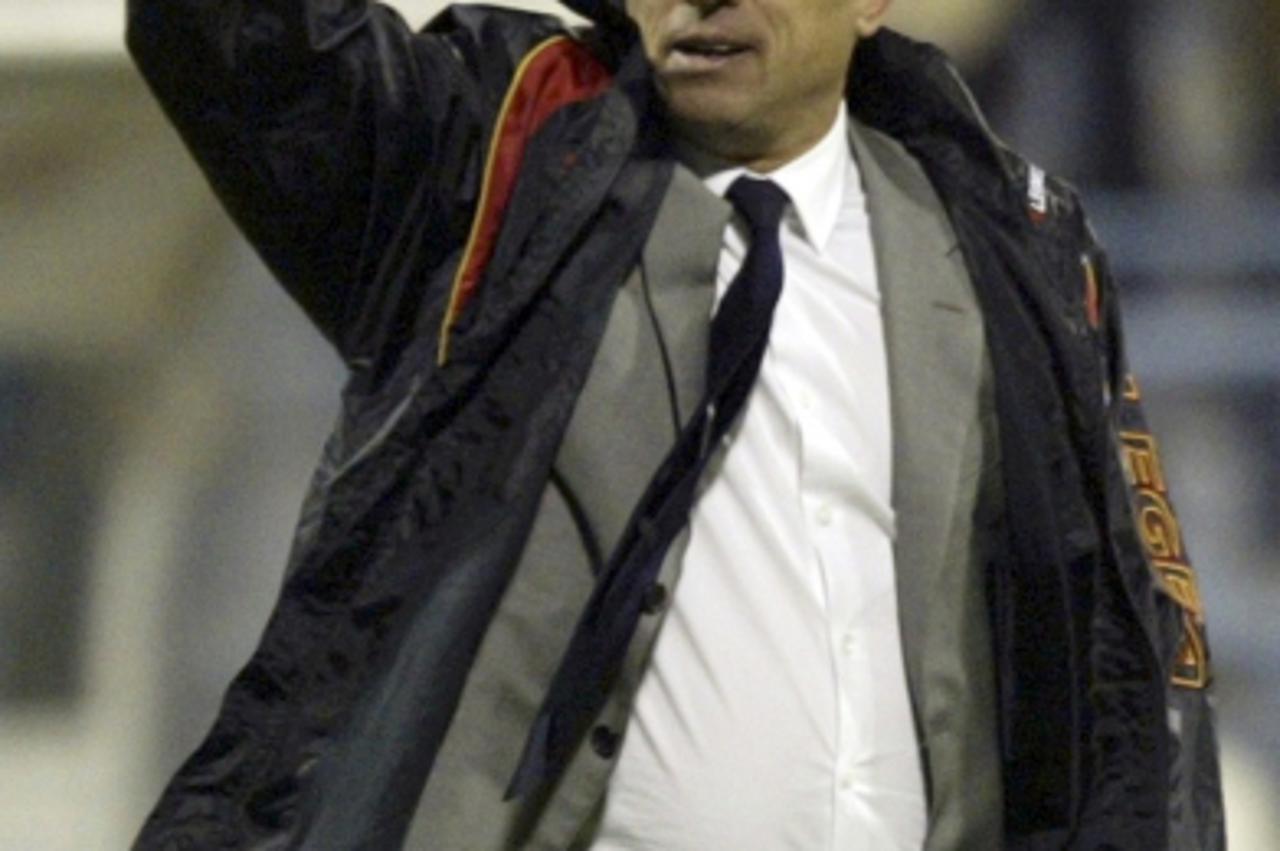 \'Montenegro\'s head coach Zlatko Kranjcar gestures as he leaves the pitch after the match of his team against Switzerland during their Euro 2012 qualifying soccer match in Podgorica, October 8, 2010.