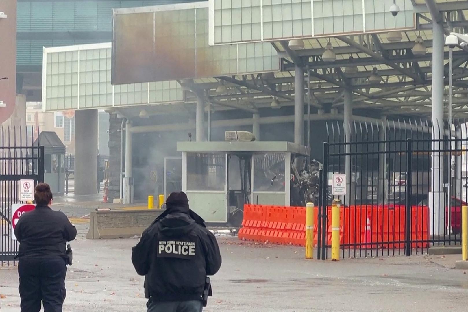 Police officers view the scene after an incident at the Rainbow Bridge U.S. border crossing with Canada, in Niagara Falls, New York, U.S. November 22, 2023 in a still image from video.  REUTERS/Reuters TV Photo: REUTERS TV/REUTERS
