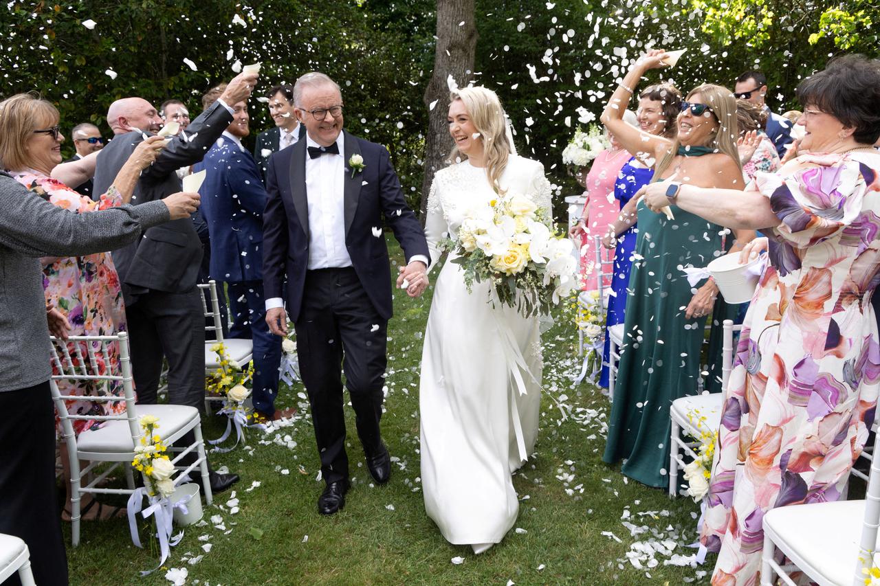 Australian Prime Minister Anthony Albanese and Jodie Haydon walk down the aisle after getting married in Canberra