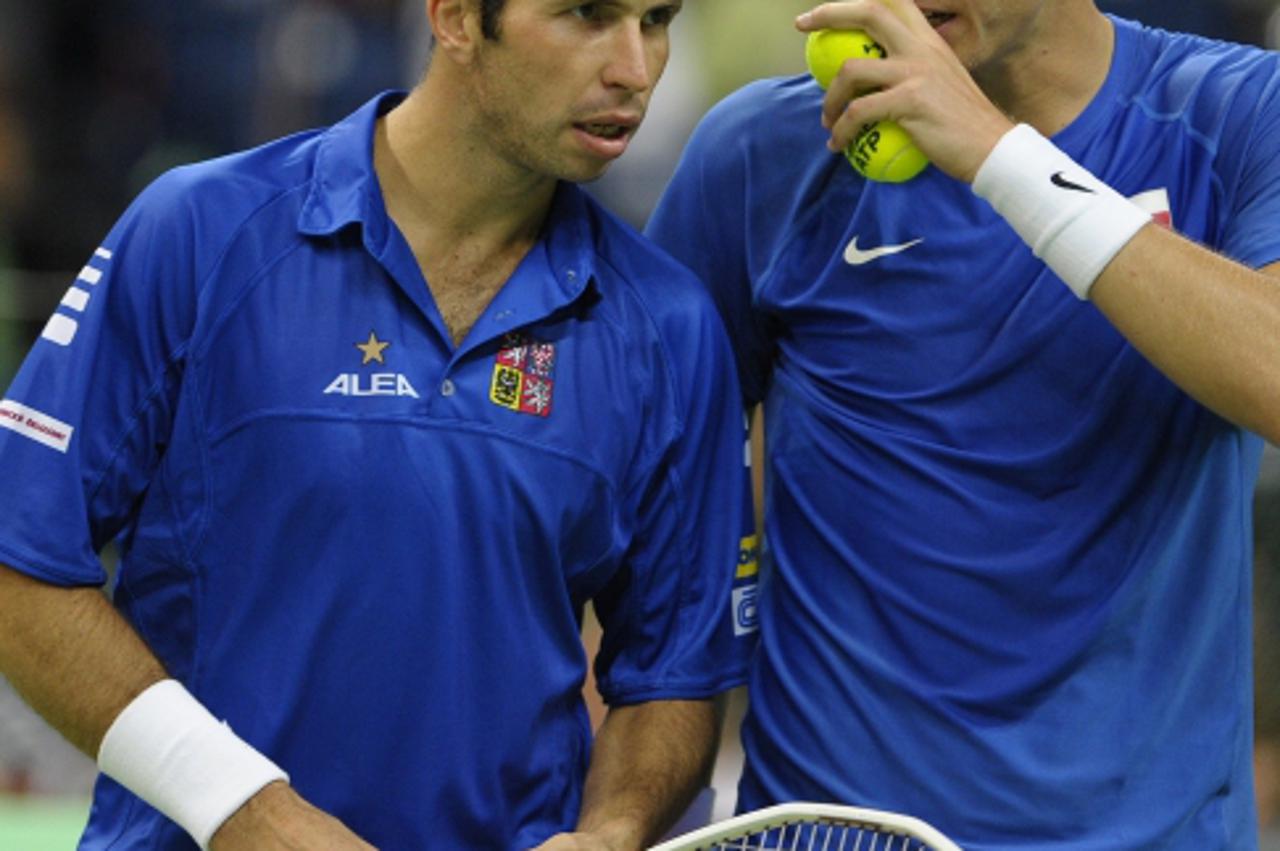 'Radek Stepanek (L) and teammate Tomas Berdych (R) of the Czech Republic compete against Novak Djokovic and Nenad Zimonjic of Serbia during their Davis Cup World Group semi final tennis match on Septe