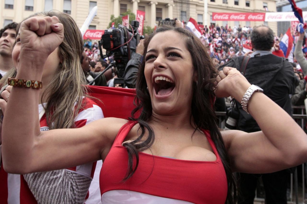 'Paraguayan model Larissa Riquelme reacts during a public screening of the World Cup soccer match between Paraguay and Japan in downtown Asuncion, in this June 29, 2010 file photo. Riquelme told a liv
